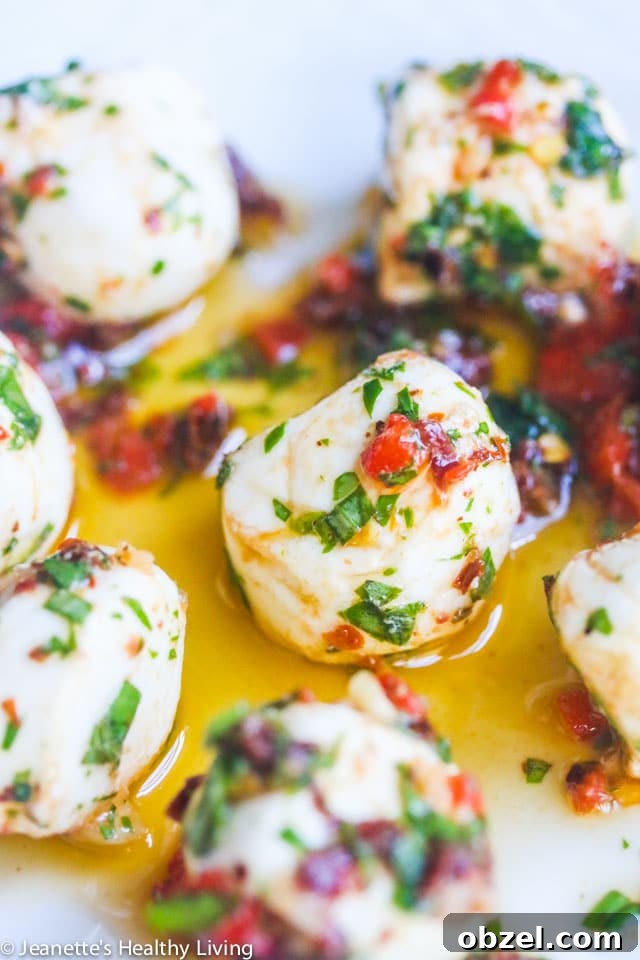 Marinated Mozzarella Balls - skewer with cherry tomatoes for a party appetizer - always a party favorite - super easy and delicious