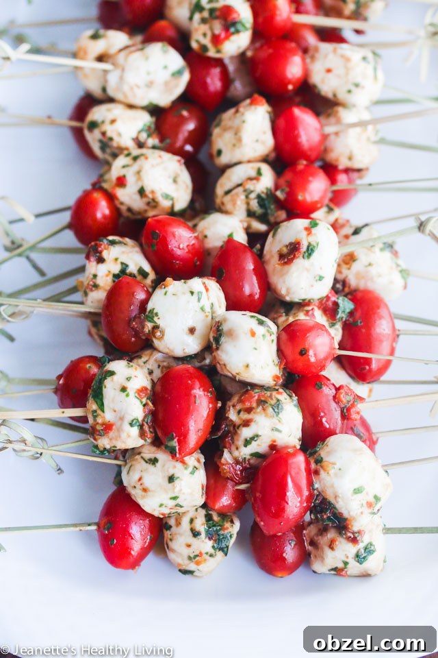 Marinated Mozzarella Balls - skewer with cherry tomatoes for a party appetizer - always a party favorite - super easy and delicious