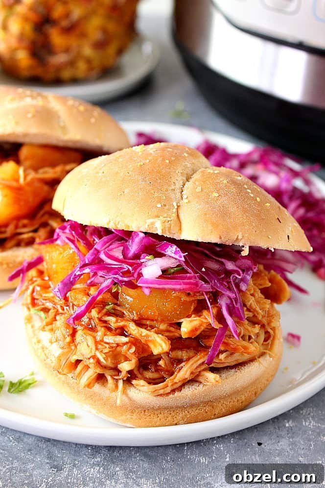 14-Day Instant Pot Meal Plan with Recipes and Grocery List 12 Instant Pot Hawaiian BBQ Chicken sandwiches on white plate with coleslaw.