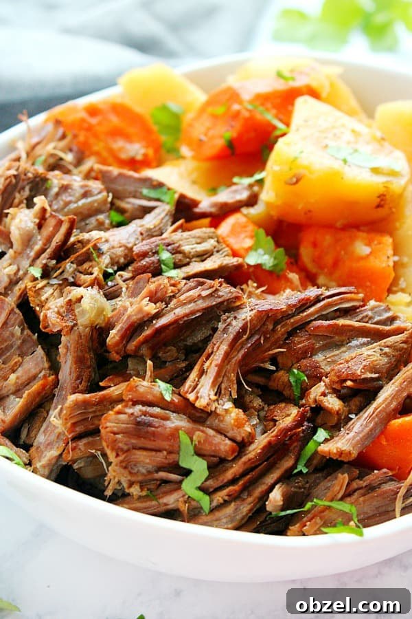 14-Day Instant Pot Meal Plan with Recipes and Grocery List 9 Pot roast with potatoes and carrots on a plate.