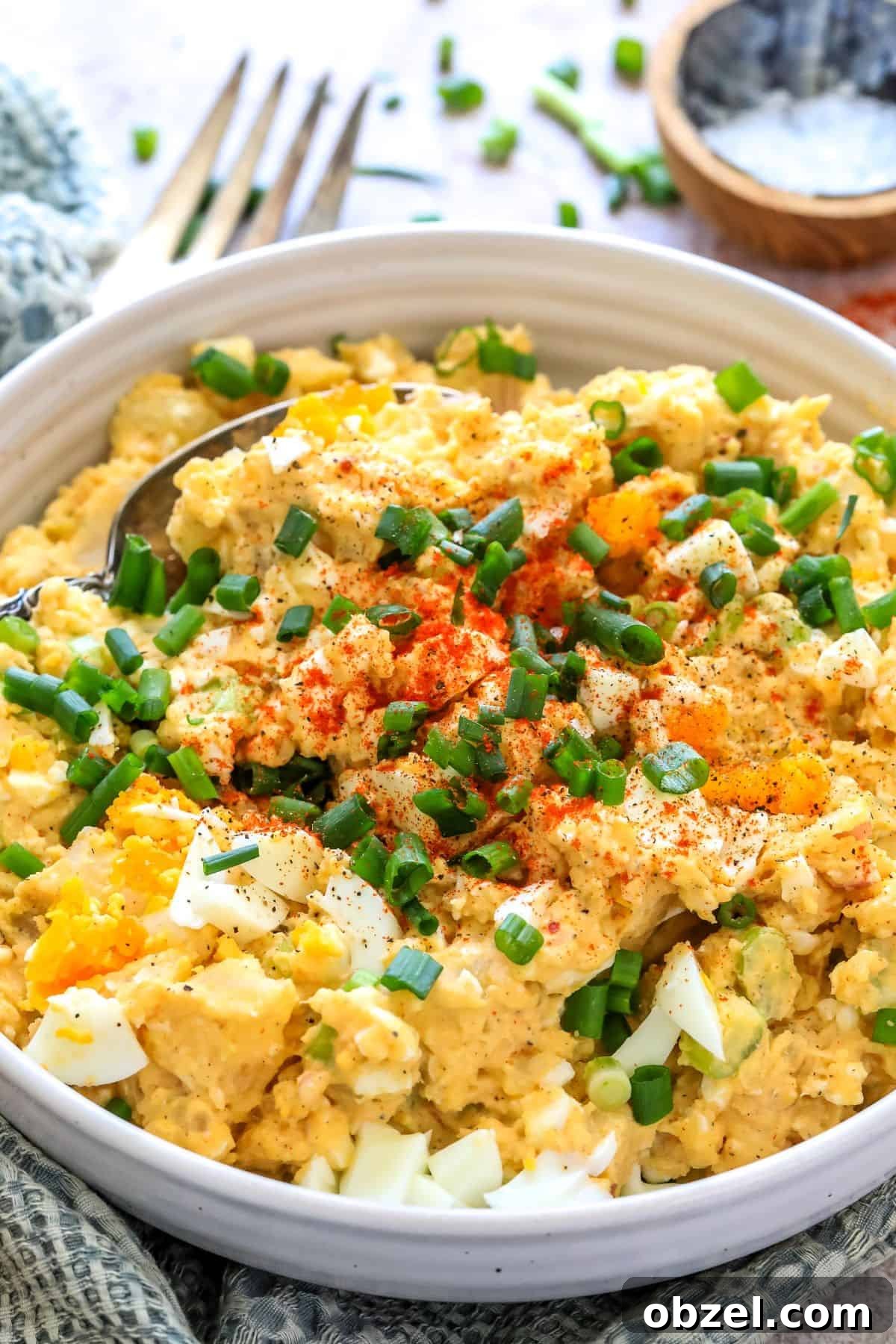 Deviled Egg Potato Salad Recipe 5 Finished deviled egg potato salad in a serving bowl.
