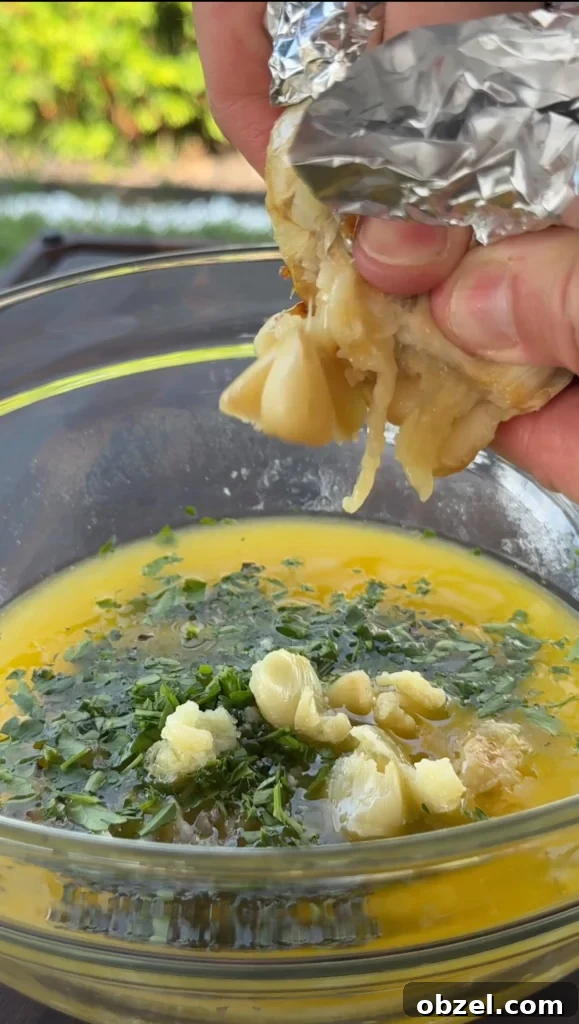 Loaded Baked Potatoes with Grilled Steak Bites 4 Garlic herb butter being prepared in small saucepan with melted butter, minced garlic, and fresh herbs like parsley and thyme