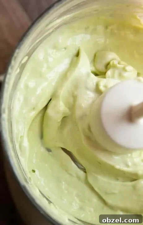Lime dressing in a blender to make Roasted Potato Salad with Avocado Lime Dressing from themerchantbaker.com
