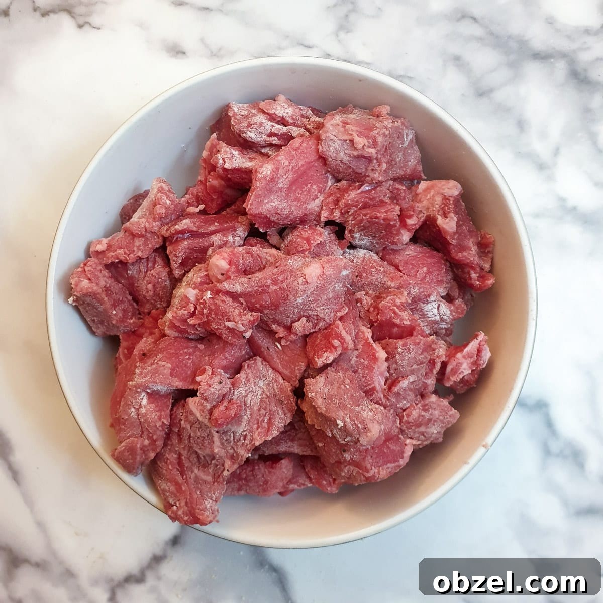 South African Beef Bredie Stew Recipe 5 A dish of pieces of beef coated with flour.