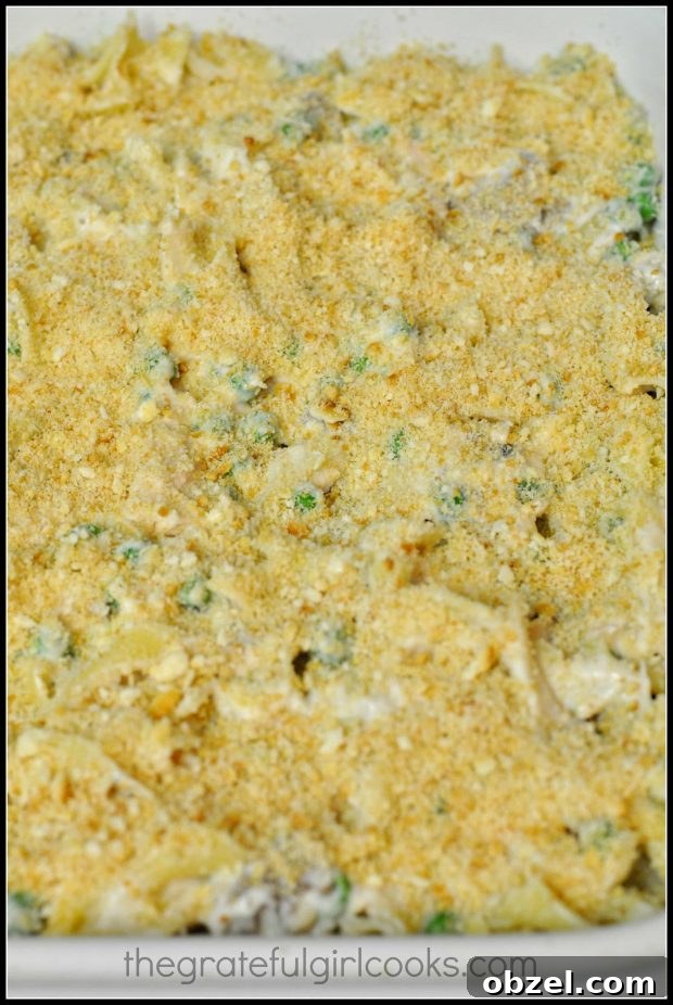Mom's Tuna Noodle Casserole - The Grateful Girl Cooks! Buttery cracker crumbs are spread on top of tuna noodle casserole before baking.