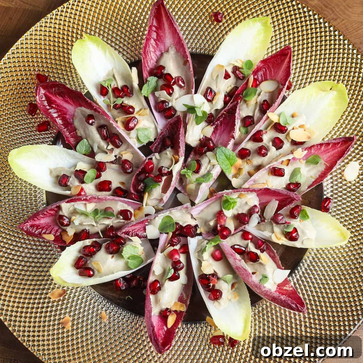 Photo of vegan and gluten-free chicory canapés on a gold plate.