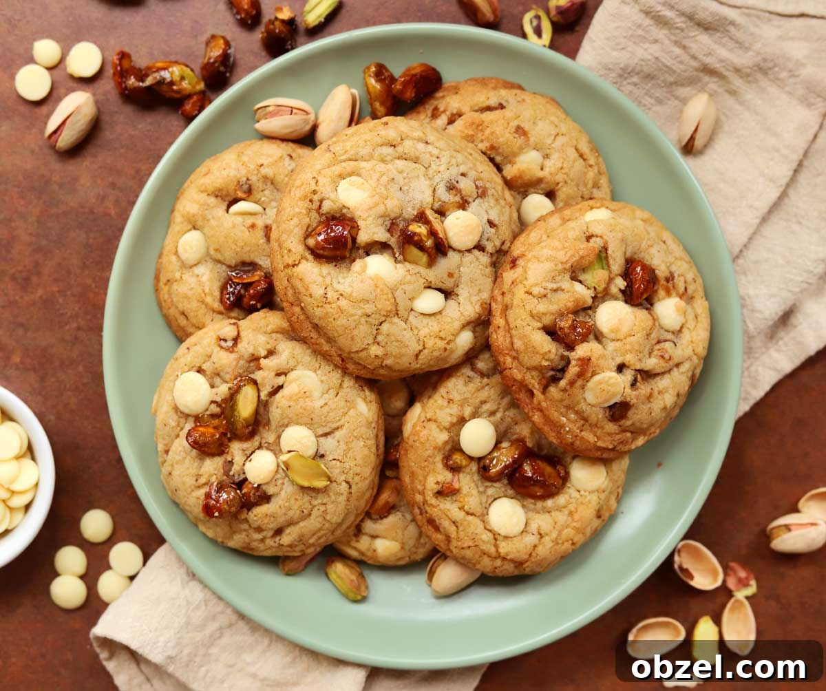 Brown Butter Pistachio White Chocolate Cookies 6 top view of caramelized pistachio brown butter white chocolate cookies on a plate