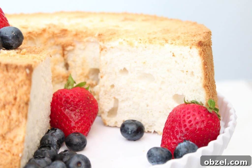 Fluffy Gluten Free Angel Food Cake Recipe 3 Sliced gluten free angel food cake with berries