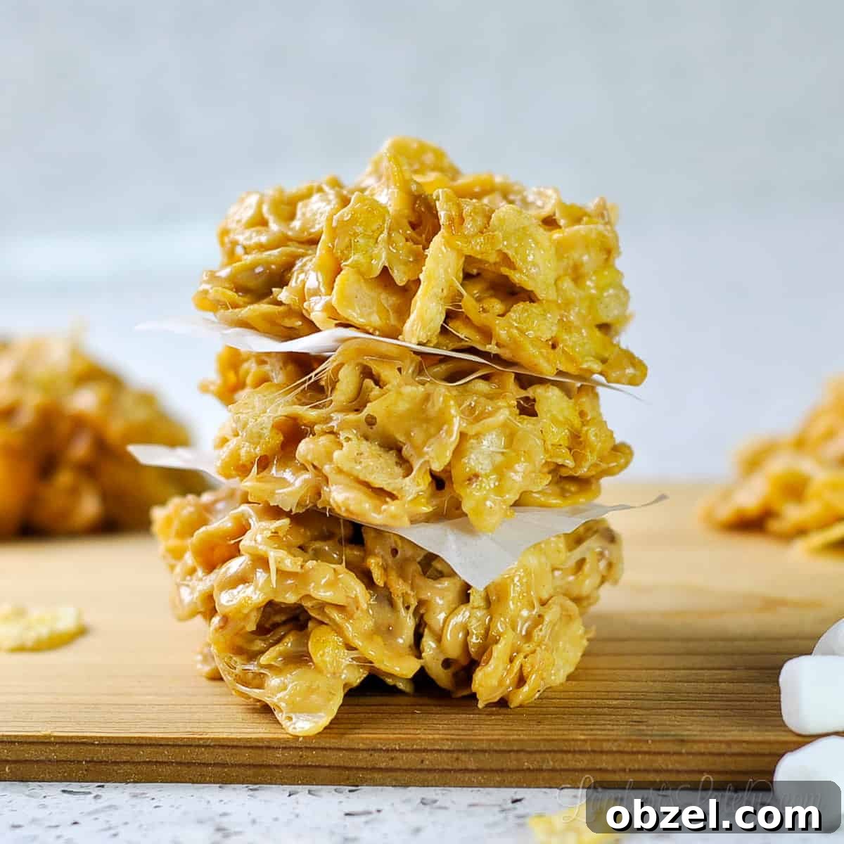 No Bake Muddy Buddy Cookies 10 fluffernutter cookies stacked on a cutting board.