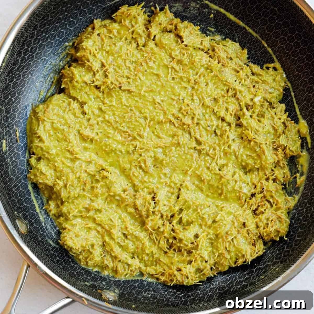 Dubai Chocolate Bar Recipe with Pistachio Knafeh Filling 6 Pistachio cream kunafa filling in a skillet.