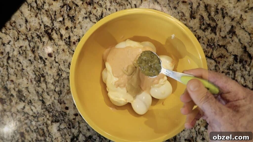 Adding relish to bowl