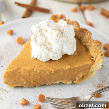 Slice of butterscotch cinnamon pie on plate with whipped cream on top.