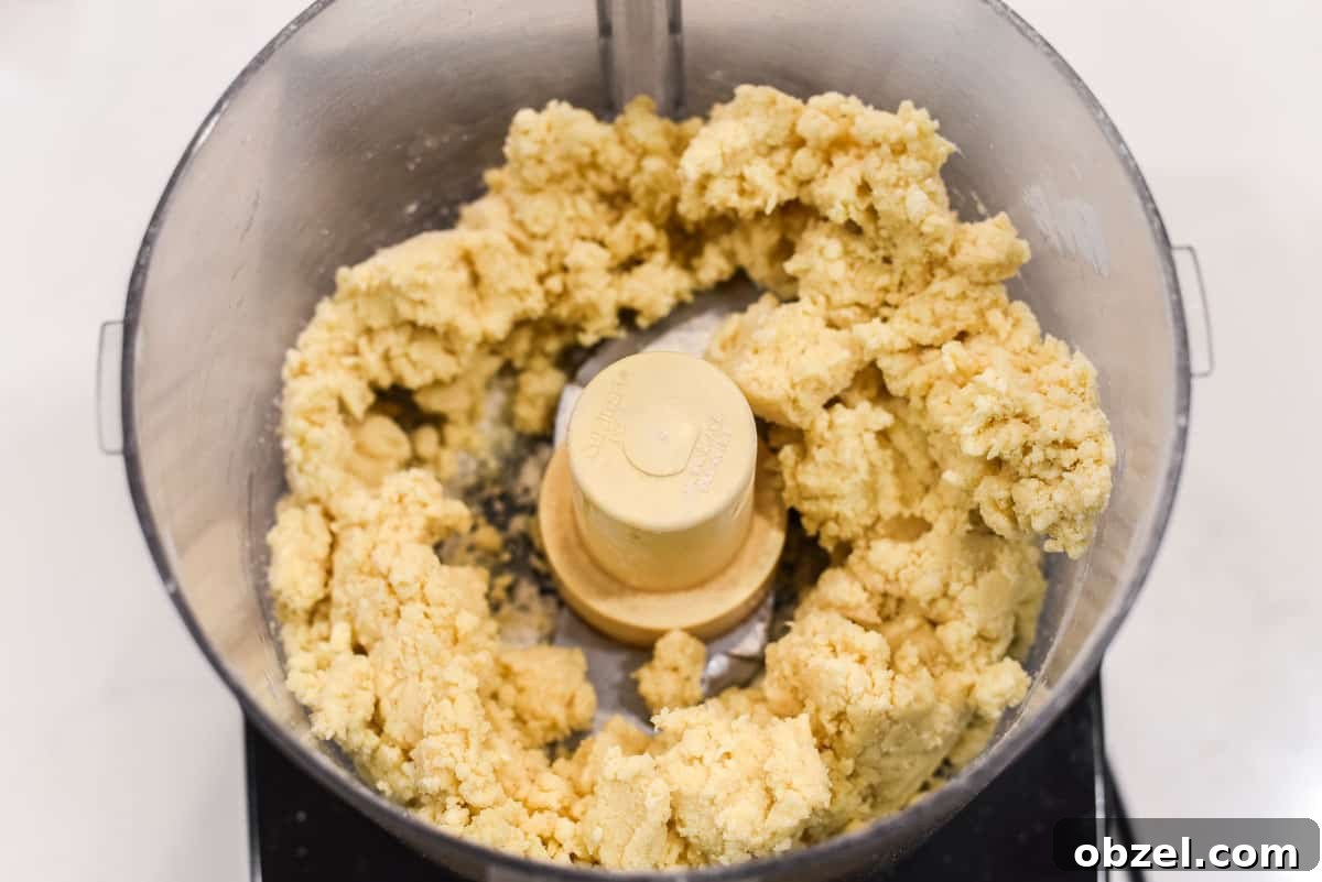 Pulsed pie dough in food processor.