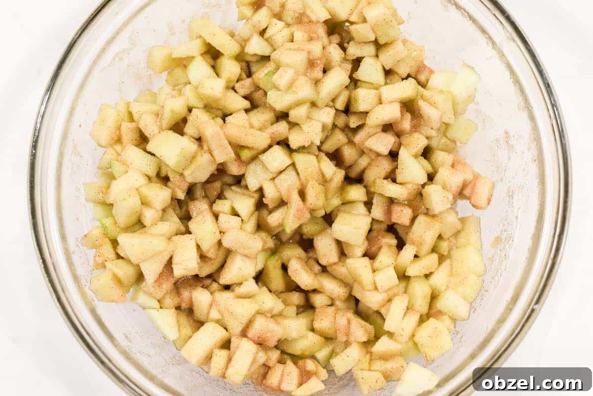 Diced apples mixed with the rest of the filling ingredients.