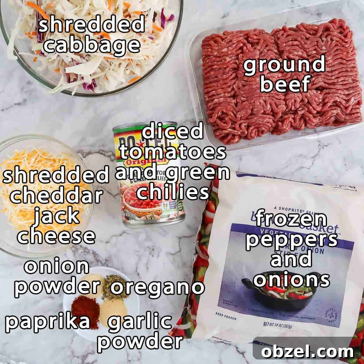 One Skillet Stuffed Cabbage Casserole Recipe 3 Overhead shot of ingredients - shredded cabbage, ground beef, frozen peppers and onions, diced tomatoes and green chilies, shredded cheddar jack cheese, onion powder, oregano, paprika, and garlic powder.