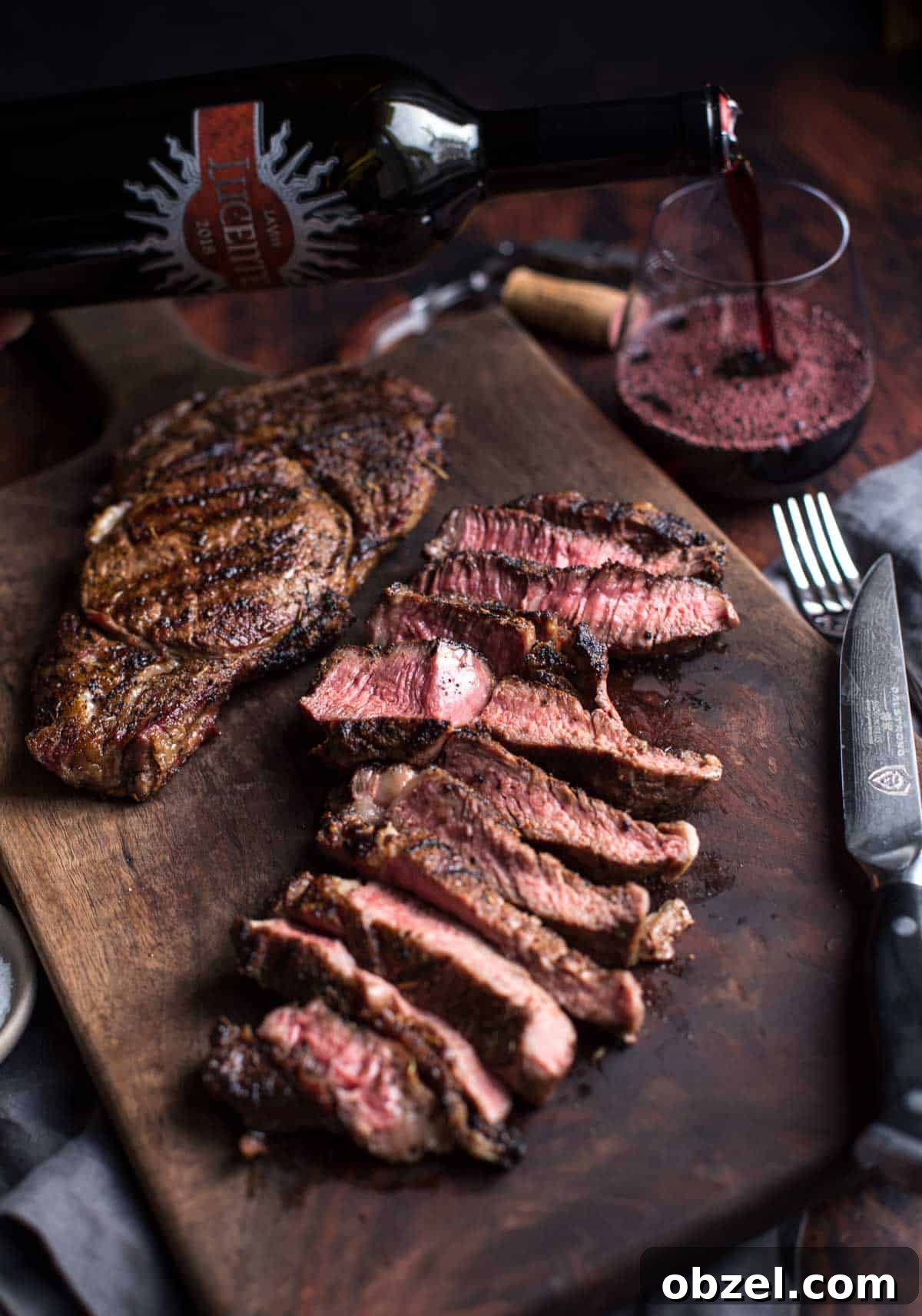 Wine Pairing Guide: How to Match Wine with Food 3 Ribeye steak sliced with a glass of red wine.