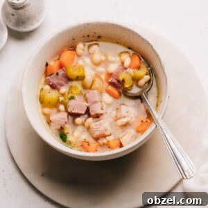 Ham bone soup recipe in a bowl with a spoon
