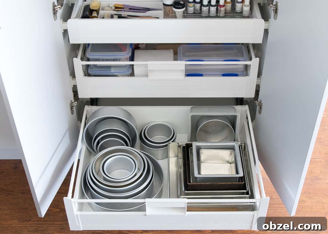 Kitchen Renovation and New Cake Pantry Reveal 24 The lower drawer, filled with nested round and square cake pans in varying sizes.