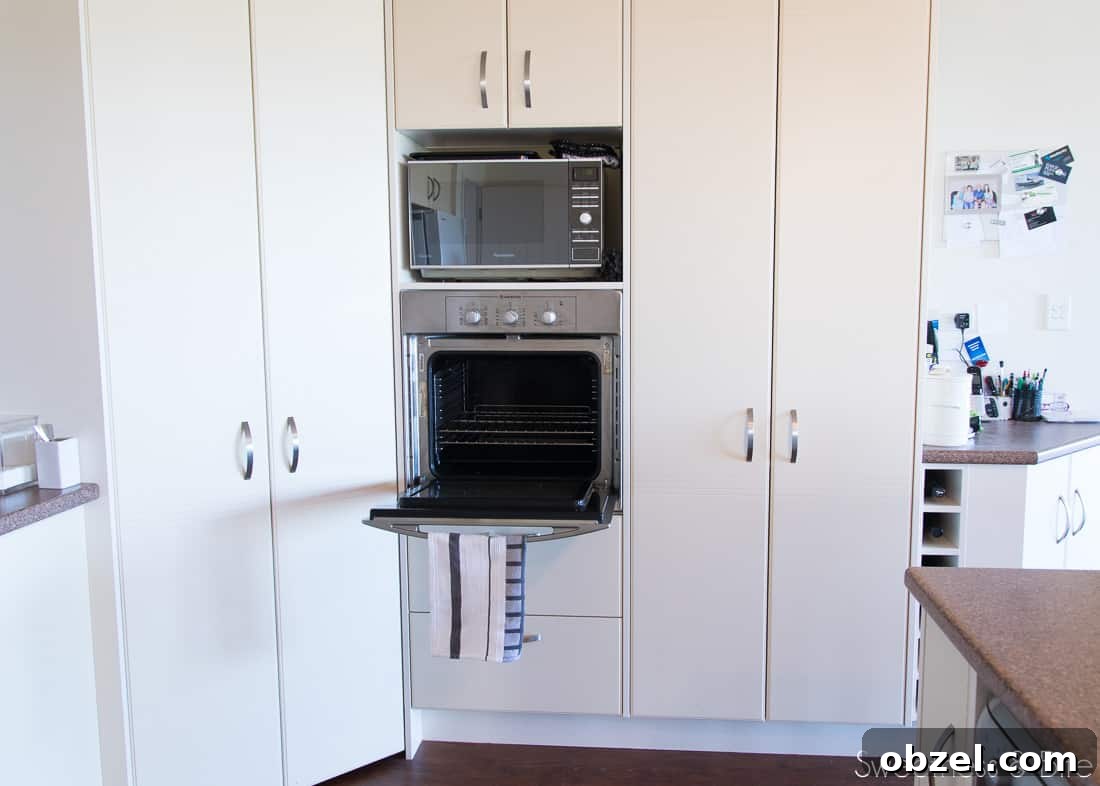 Kitchen Renovation and New Cake Pantry Reveal 4 Beige cabinetry with a very small in-built wall oven.