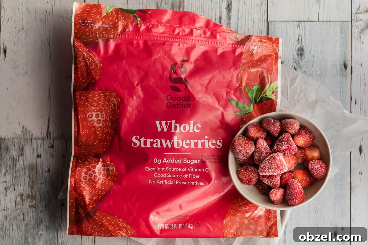 Homemade Strawberry Puree for Babies 3 package of frozen strawberries with fruit in a bowl