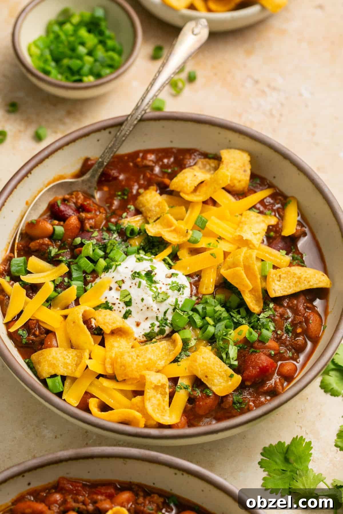 beef chili with cheese in bowls