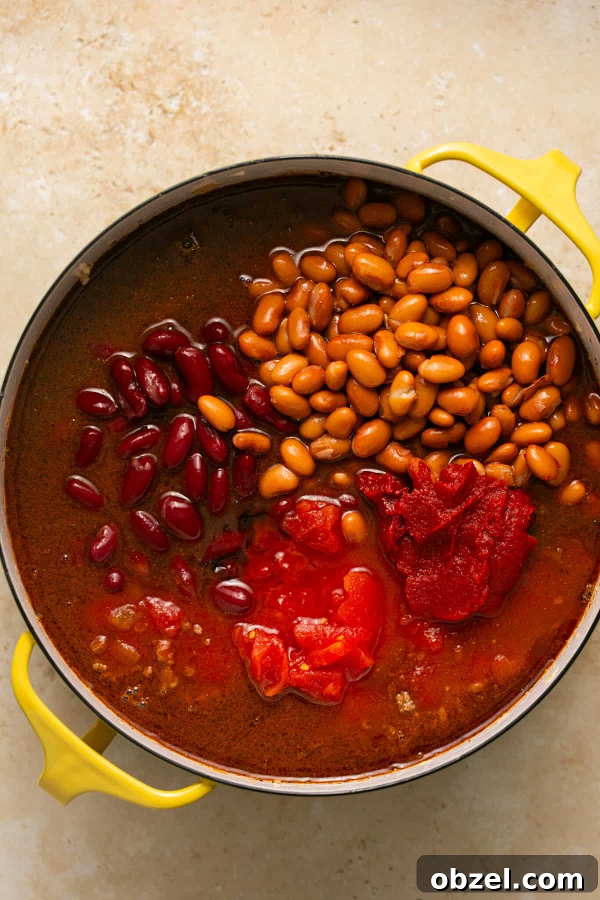 beef chili ingredients in dutch oven