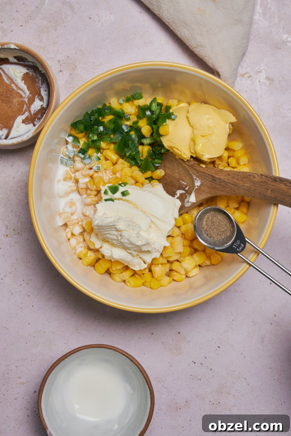 Jalapeno Corn Casserole with Cheddar 5 Ingredients for jalapeno corn casserole in a white mixing bowl