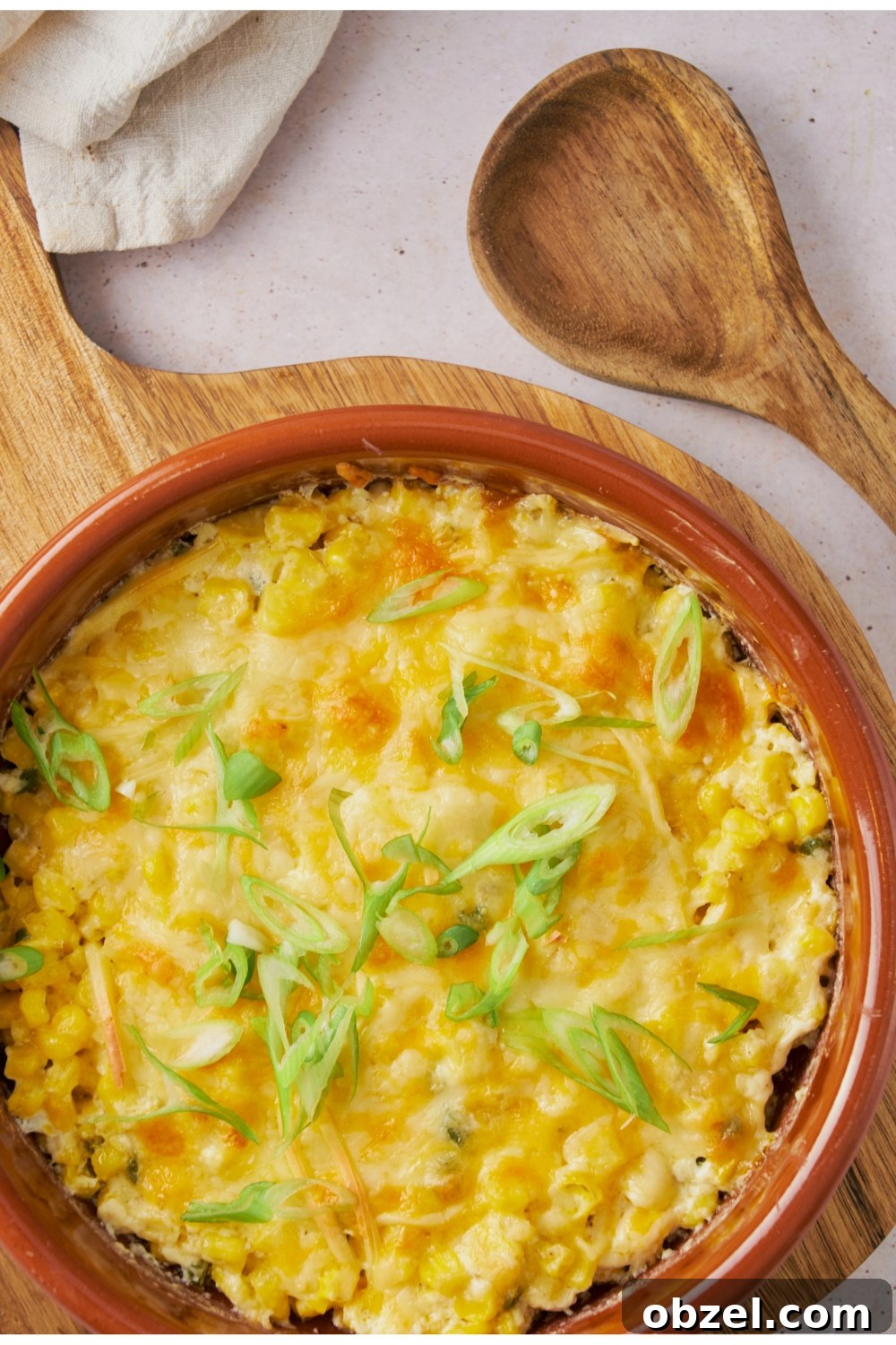 Jalapeno Corn Casserole with Cheddar 7 Jalapeno corn casserole in a red serving dish.