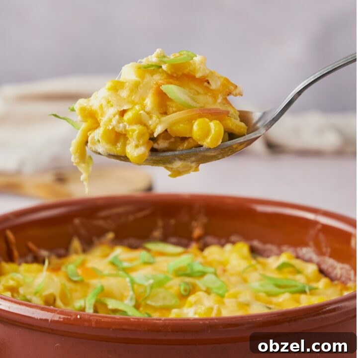 A spoonful of cooked jalapeno corn casserole