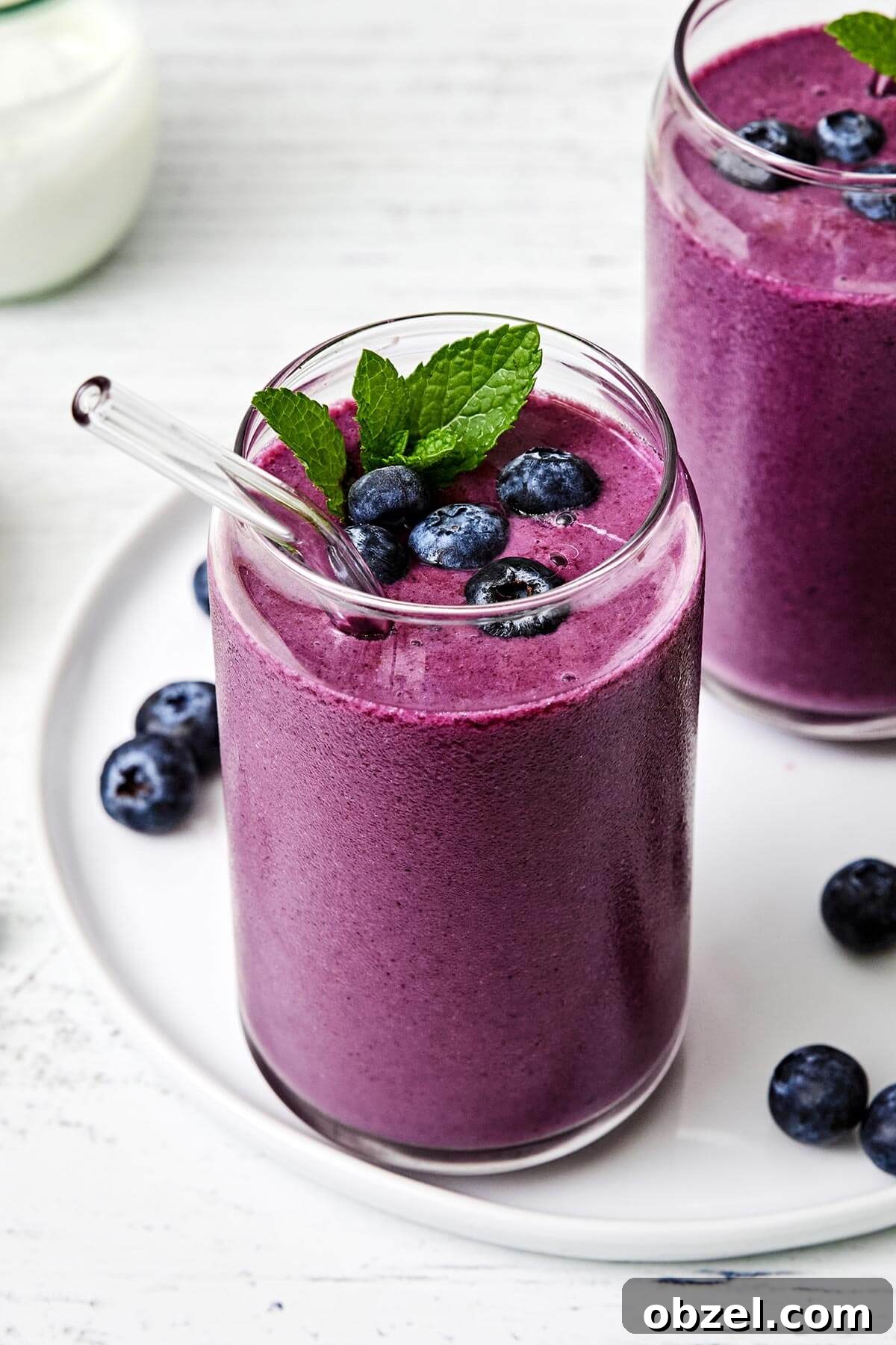 A glass of blueberry smoothie.