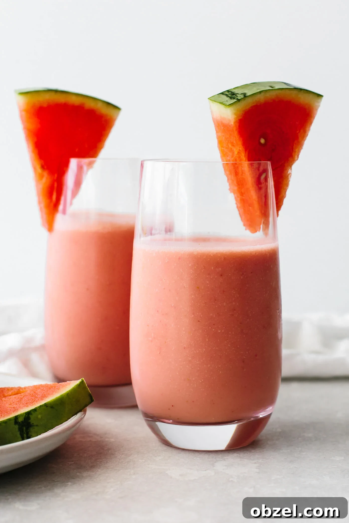 Watermelon smoothies in glasses with fresh watermelon