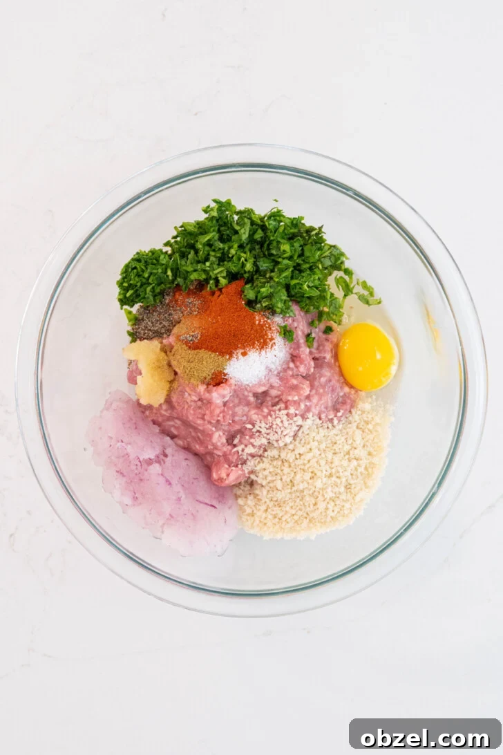 Tender Juicy Baked Moroccan Lamb Meatballs 5 A bowl with ground lamb, egg, and more.