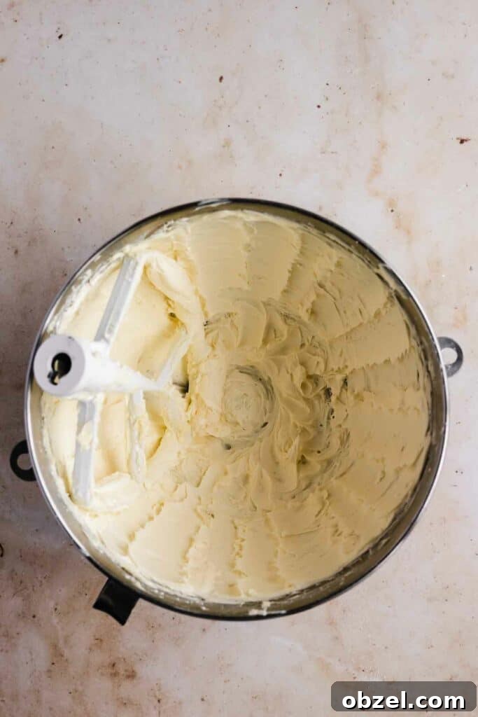 Beating butter and powdered sugar for the buttercream