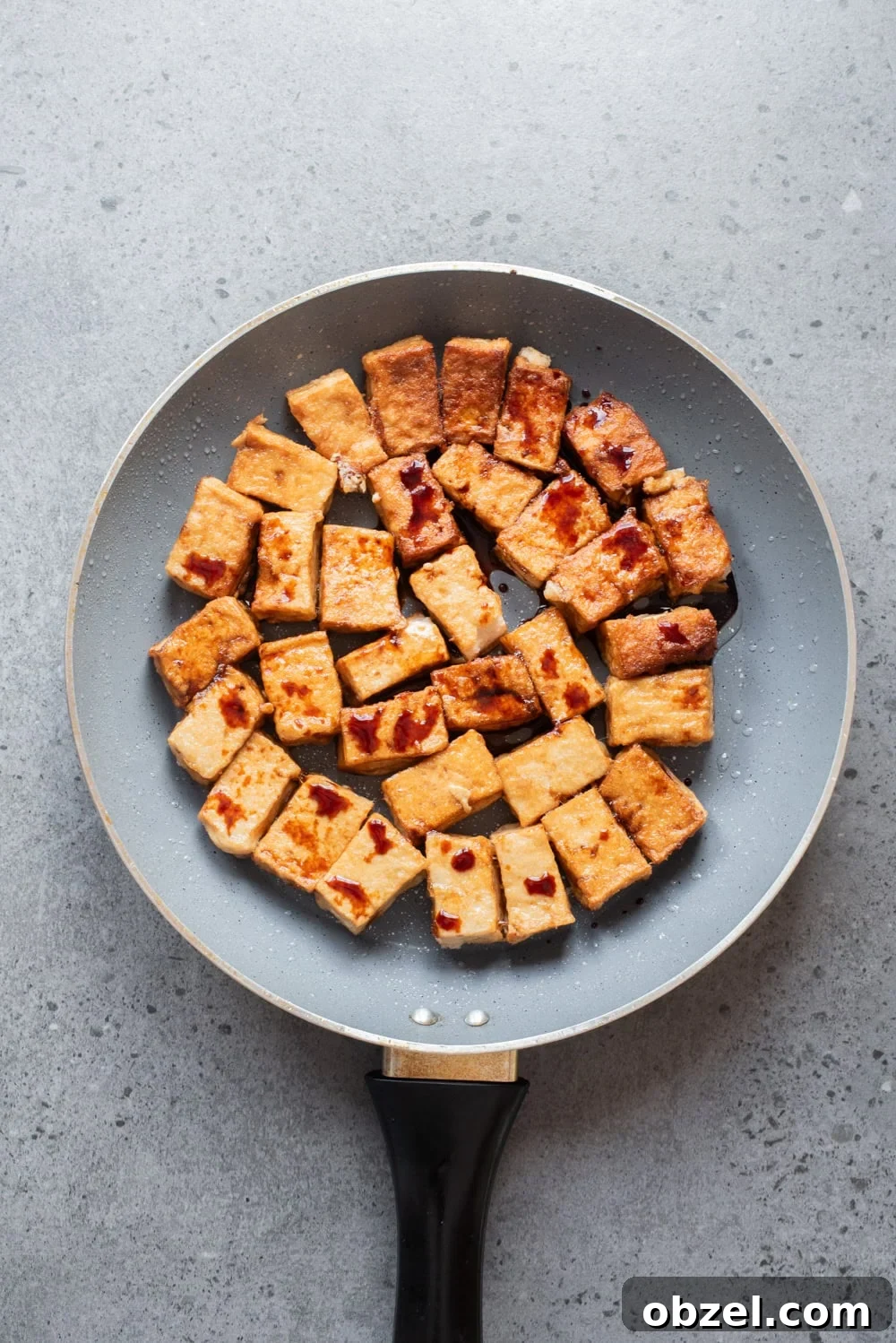 Crispy Thai Peanut Tofu Bowl 9 An overhead image of frying the tofu in a pan.