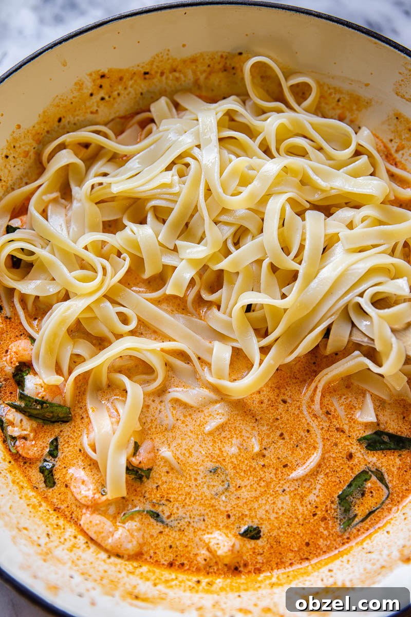 Linguine in creamy sun-dried tomato sauce with shrimp and basil