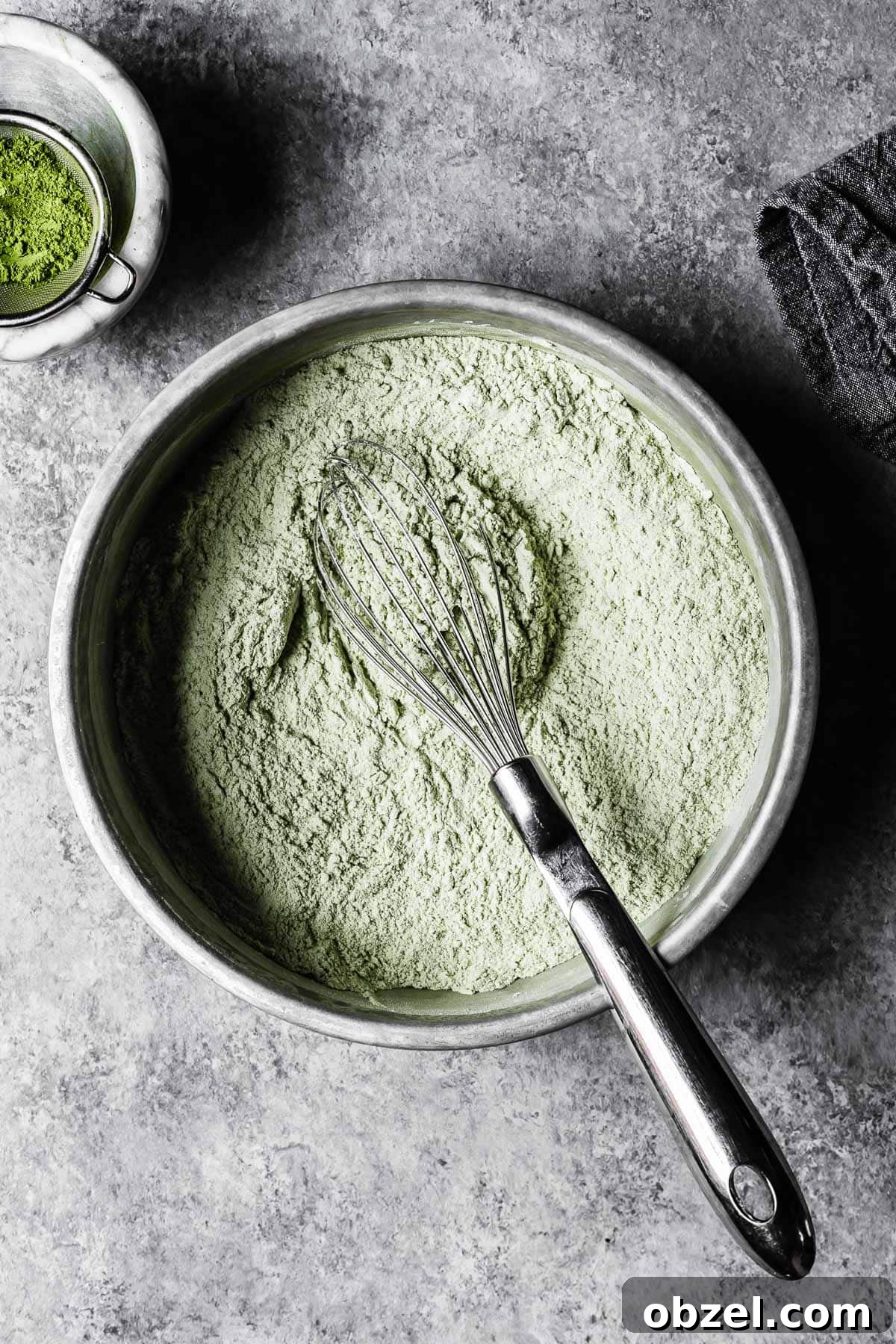 Matcha White Chocolate Cookies Recipe 4 Dry ingredients for cookies whisked together in a bowl.