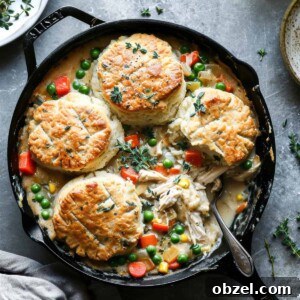 Leftover Turkey Pot Pie with Flaky Biscuits 3 Turkey pot pie with biscuits in a skillet.