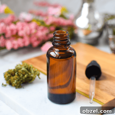 Decarboxylating CBD Flower: Lab-Tested Method and Results 17 A picture of a bottle of CBD oil with fresh cananabis buds.