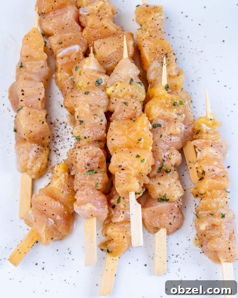Grilled Lemon Chicken Skewers with Garlic and Herbs 5 chicken on kabobs with herbs and seasoning