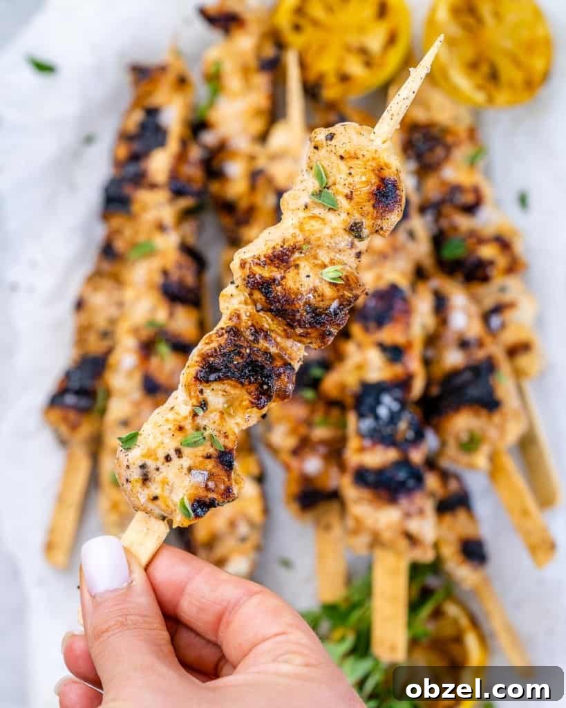 Grilled Lemon Chicken Skewers with Garlic and Herbs 7 close view of grilled chicken kabob with lemon and pepper