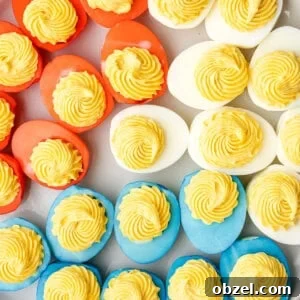 overhead plate of red white and blue colored deviled eggs