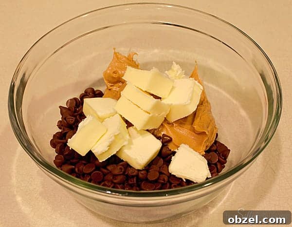 Place the chocolate, peanut butter and butter in a microwave safe bowl. Place the chocolate, peanut butter and butter in a microwave safe bowl.