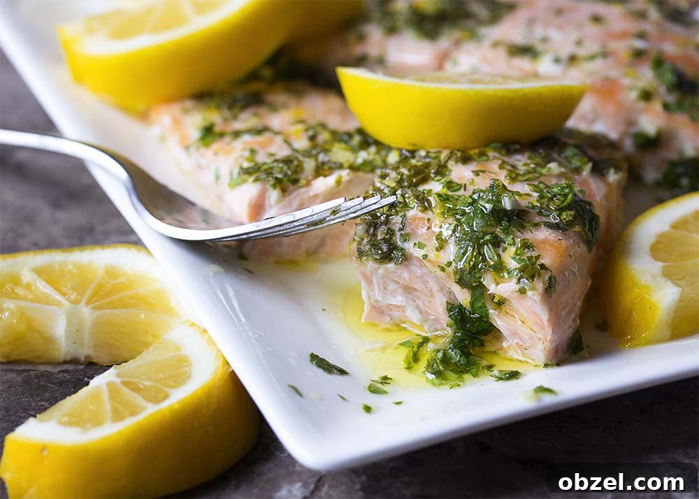Moist and tender slow roasted salmon fillet. A moist and tender salmon fillet cut in half ready to be served for dinner.