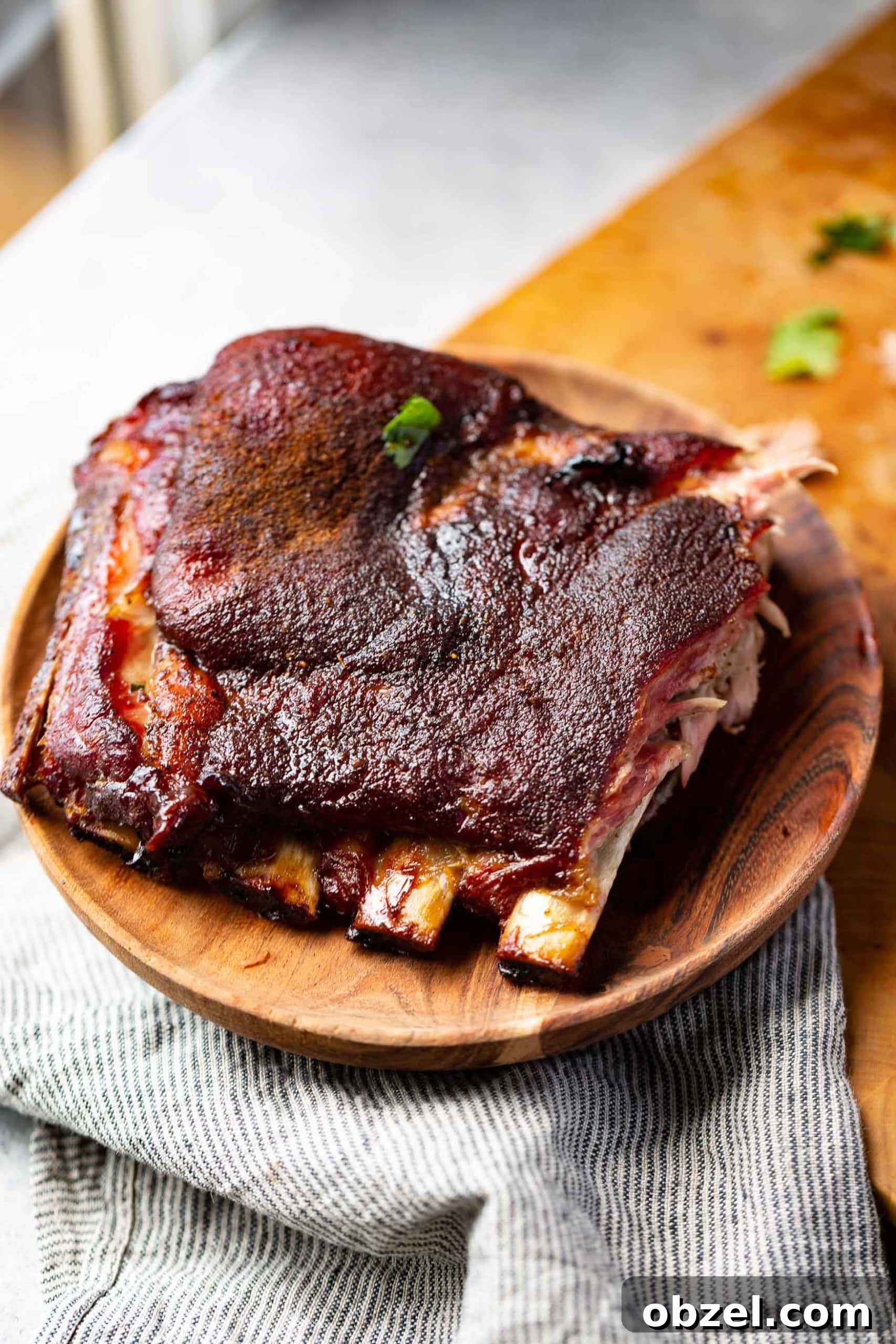 Easy BBQ Spare Ribs a photo of a plate of grilled ribs coated in a dry rub