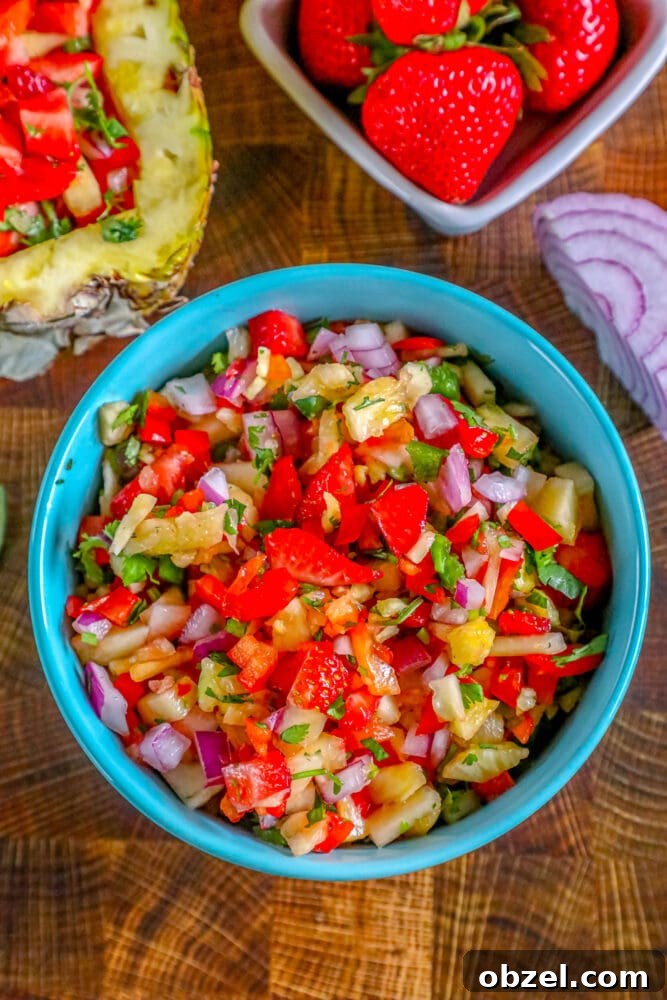 Fresh Pineapple Strawberry Salsa Recipe 4 Pineapple strawberry salsa served in a blue bowl