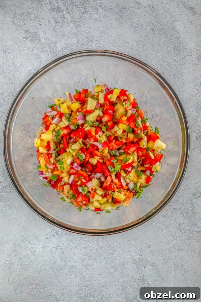 Fresh Pineapple Strawberry Salsa Recipe 8 Bowl of pineapple strawberry salsa ingredients on a table