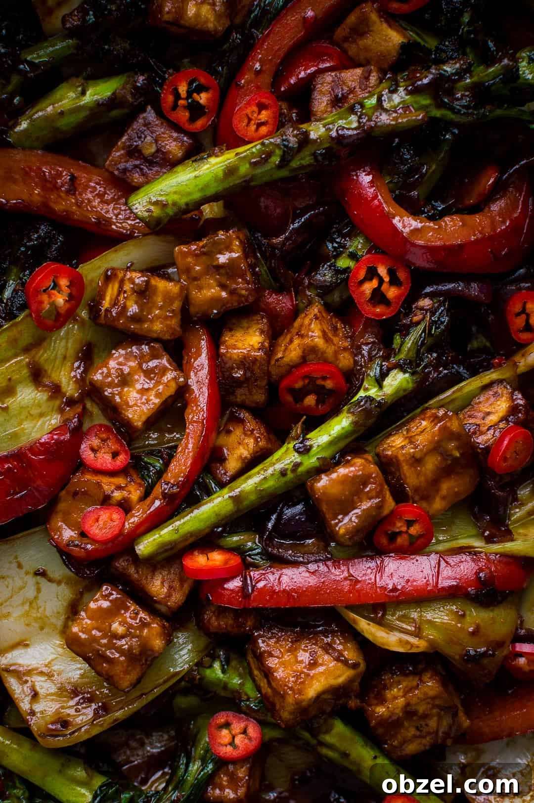 Close up of tofu and vegetable stir fry with peanut butter sauce