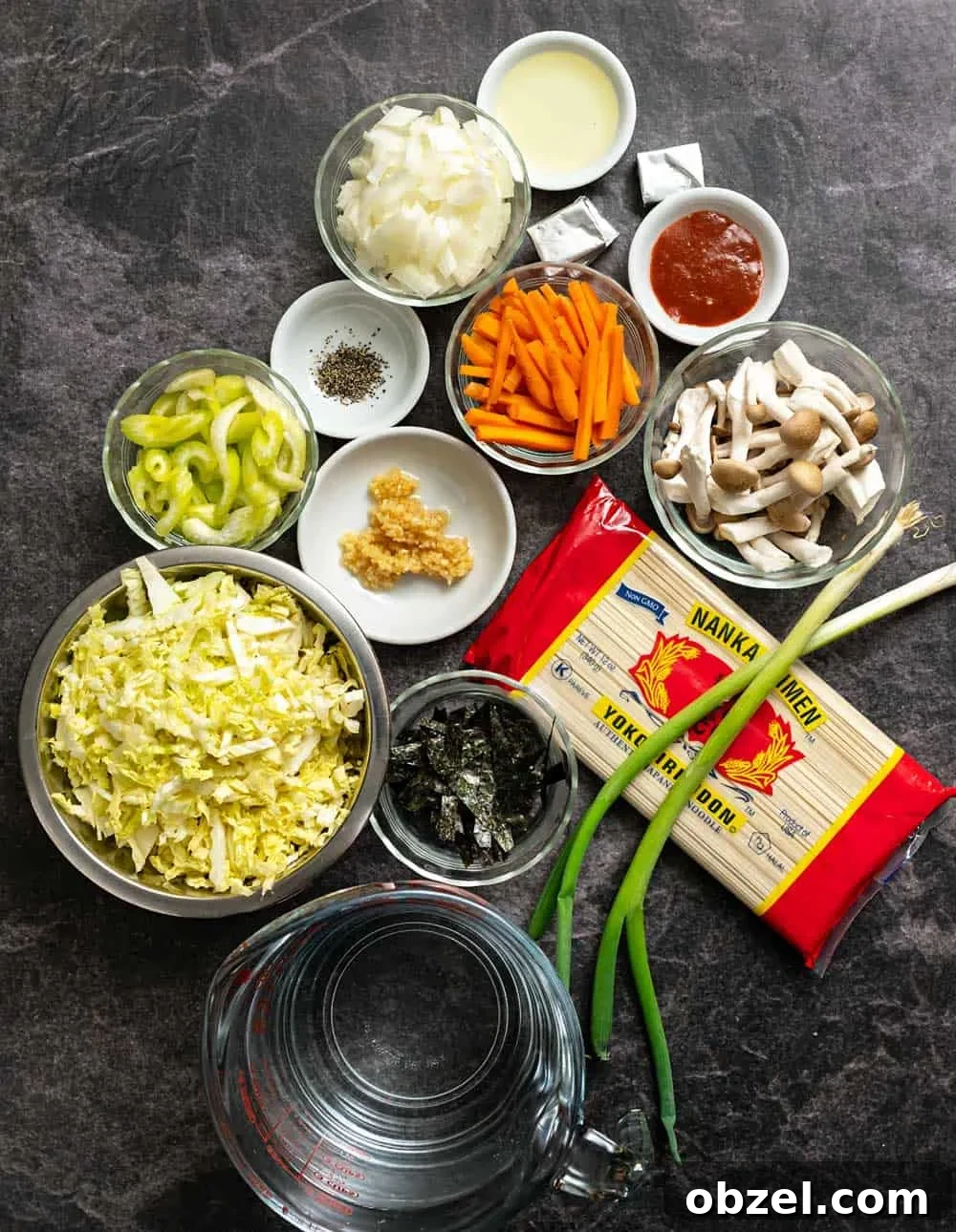 Spicy Vegan Udon Noodle Soup Recipe 4 Noodles, veggies, and other ingredients for soup in bowls