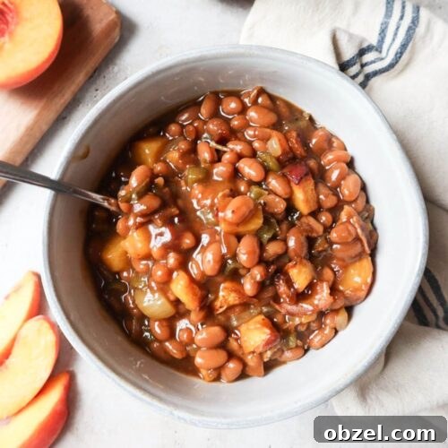 white bowl with peach baked beans.