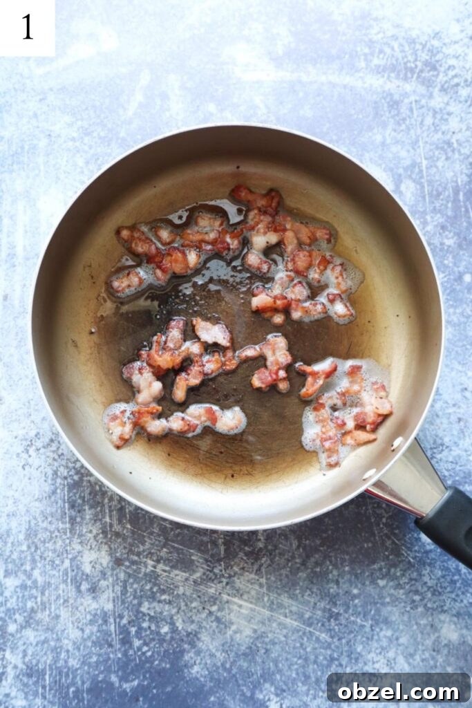 skillet with cooked browned bacon.